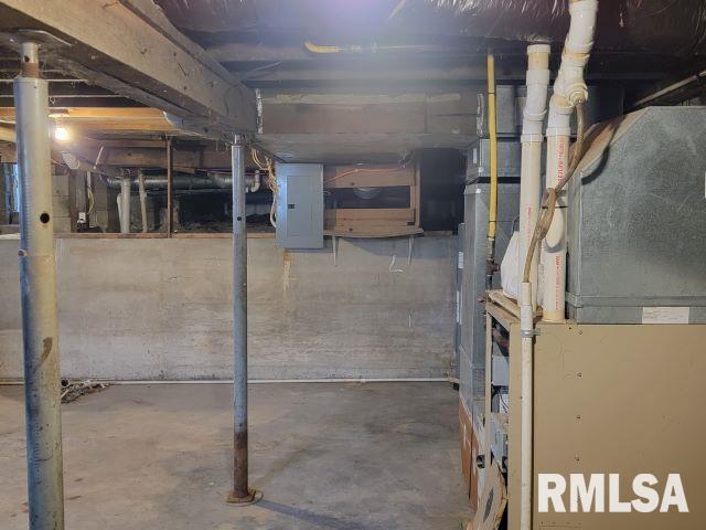 basement with heating unit and electric panel