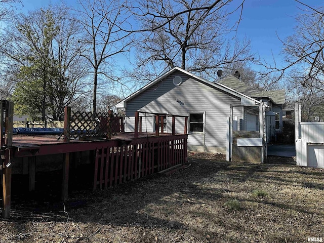 view of side of home featuring a wooden deck