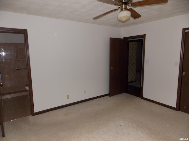 1723 Walnut Hill Rd, Centralia, IL 62801 - unfurnished bedroom with connected bathroom, light colored carpet, and ceiling fan