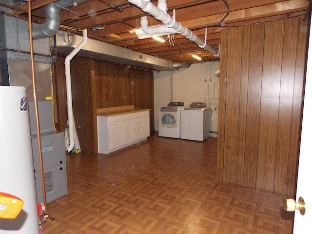 1723 Walnut Hill Rd, Centralia, IL 62801 - below grade area with washer and clothes dryer, water heater, and wood walls