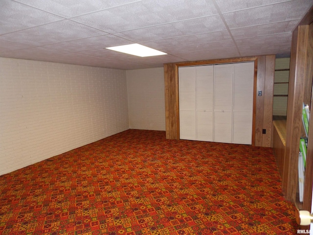 1723 Walnut Hill Rd, Centralia, IL 62801 - finished basement featuring carpet, brick wall, and a paneled ceiling
