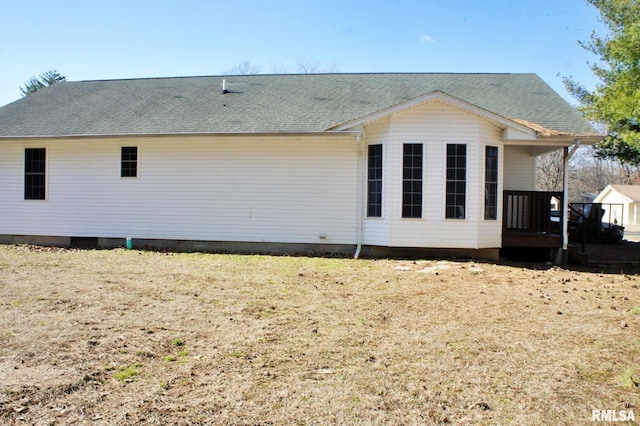 rear view of house with a yard