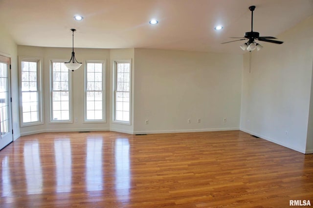 spare room with ceiling fan and light hardwood / wood-style floors