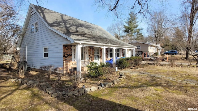 back of house with covered porch