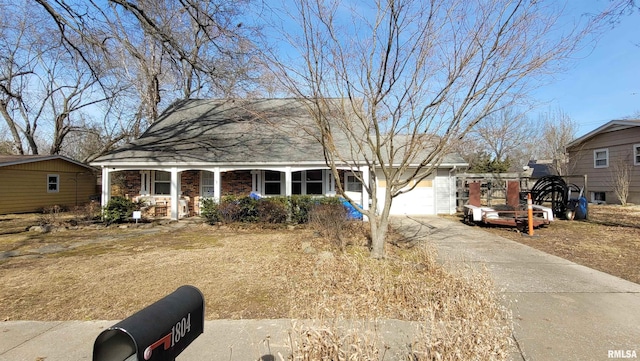 view of front facade with a porch and a garage