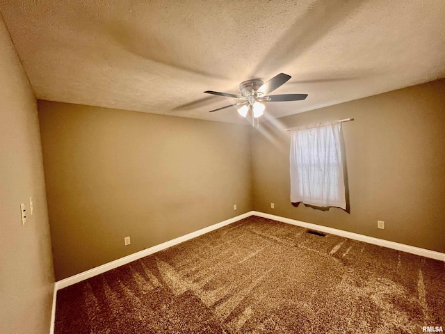 unfurnished room featuring ceiling fan, a textured ceiling, and carpet