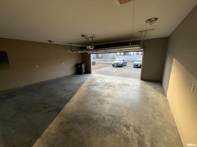 garage featuring a garage door opener and electric panel