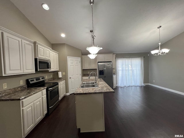 kitchen with sink, stainless steel appliances, white cabinets, and a center island with sink