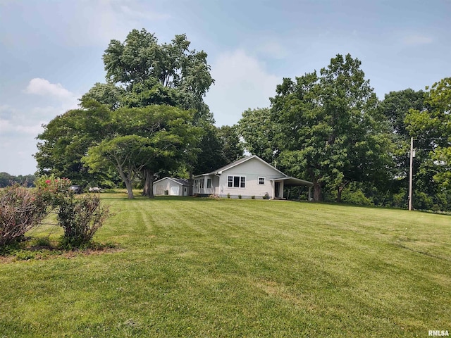 8027 Shawnee College Rd, Ullin, IL 62992 - view of green lawn with a carport