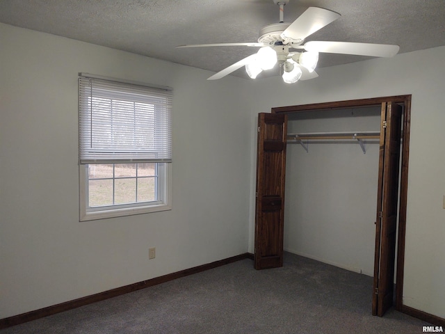 8027 Shawnee College Rd, Ullin, IL 62992 - unfurnished bedroom featuring carpet flooring, a textured ceiling, a closet, ceiling fan, and baseboards