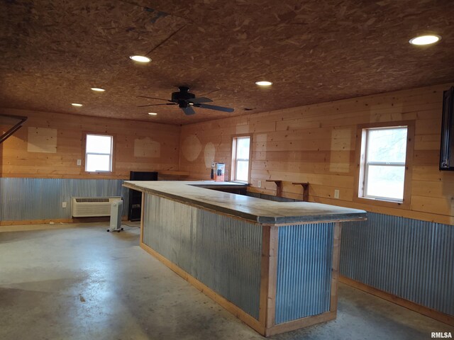 8027 Shawnee College Rd, Ullin, IL 62992 - kitchen with concrete flooring, wooden walls, recessed lighting, and ceiling fan