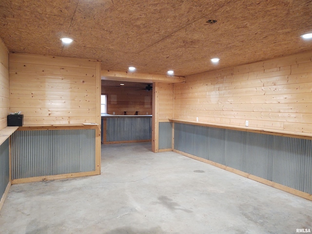 8027 Shawnee College Rd, Ullin, IL 62992 - bar area featuring recessed lighting, concrete flooring, and wood walls