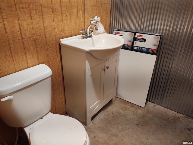 8027 Shawnee College Rd, Ullin, IL 62992 - half bath with unfinished concrete flooring, vanity, and toilet