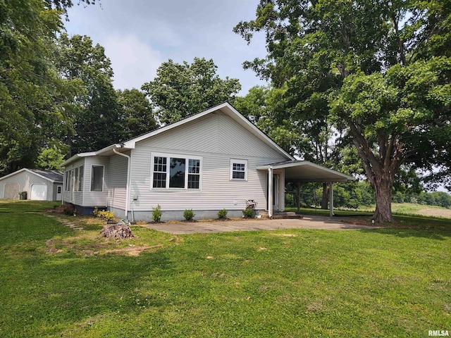 8027 Shawnee College Rd, Ullin, IL 62992 - view of front of home with a front yard and an attached carport