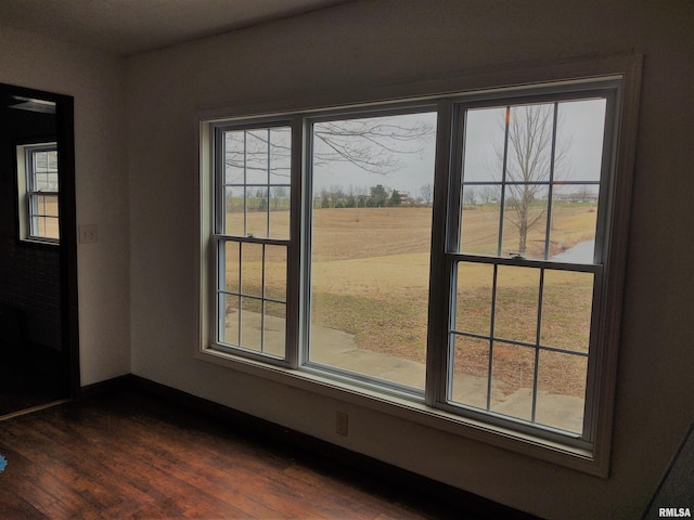 8027 Shawnee College Rd, Ullin, IL 62992 - unfurnished dining area with dark wood finished floors, plenty of natural light, and baseboards