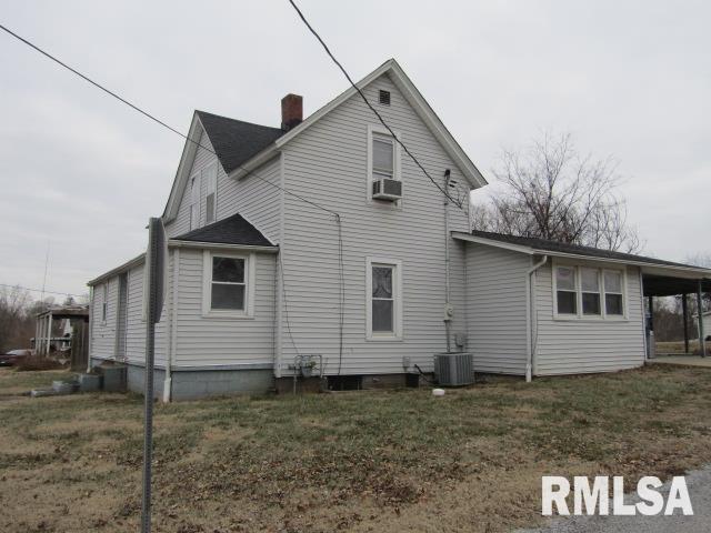 602 4th St, Rosiclare, IL 62982 - rear view of property featuring central AC and a lawn