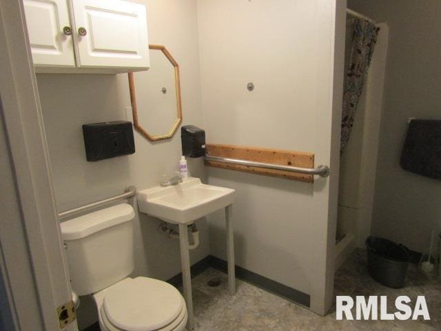 602 4th St, Rosiclare, IL 62982 - bathroom featuring walk in shower and toilet
