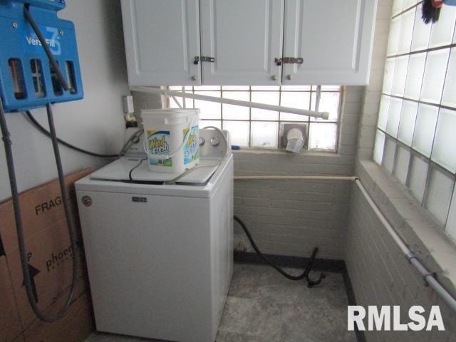 602 4th St, Rosiclare, IL 62982 - clothes washing area featuring washer / clothes dryer and cabinets
