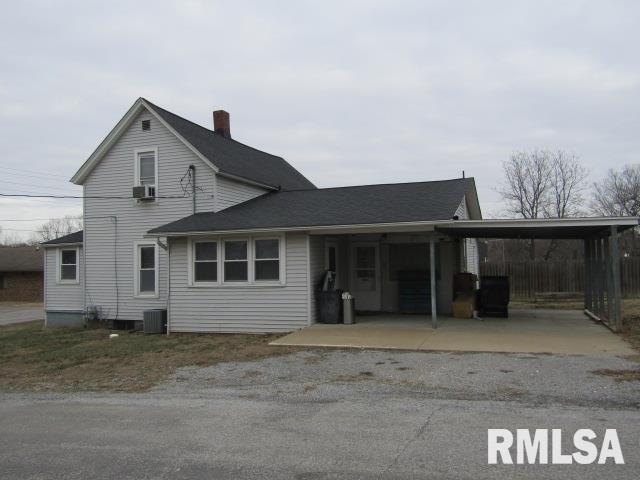 602 4th St, Rosiclare, IL 62982 - view of front of home with central AC and a carport