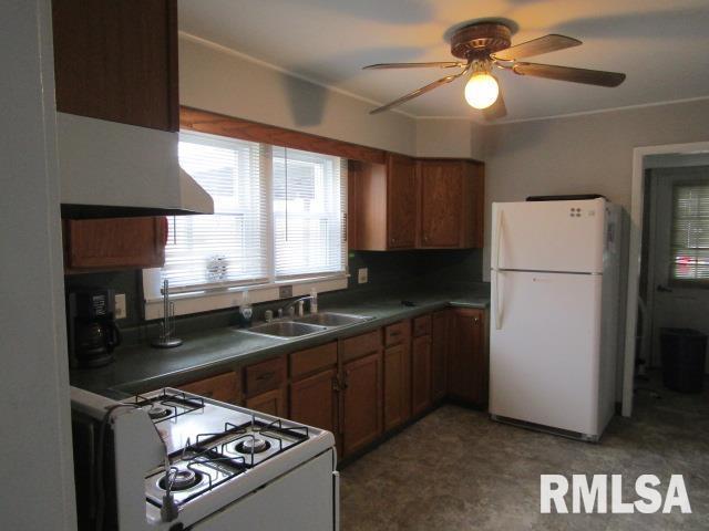 602 4th St, Rosiclare, IL 62982 - kitchen featuring ceiling fan, sink, and white appliances