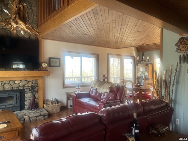 living room featuring hardwood / wood-style flooring, an inviting chandelier, wooden ceiling, and a fireplace