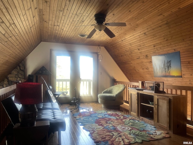 interior space with vaulted ceiling, wooden ceiling, and light wood-type flooring