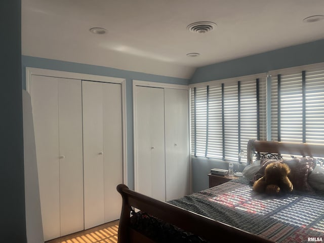 bedroom with two closets