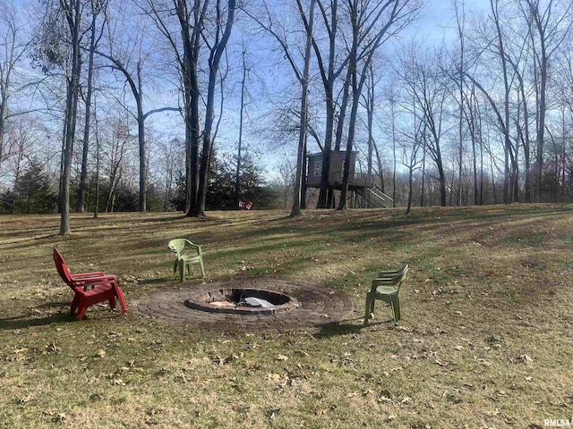 view of yard with an outdoor fire pit