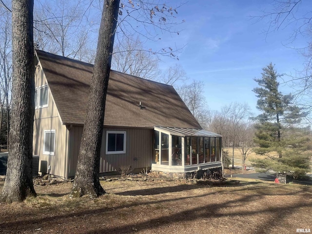 view of home's exterior featuring a sunroom