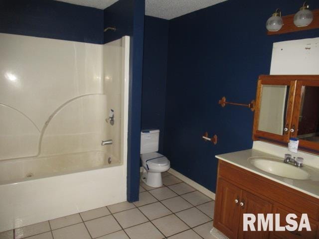 full bathroom with tile patterned flooring, shower / tub combination, vanity, and toilet