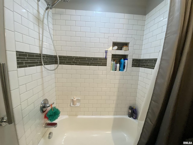 bathroom featuring shower / tub combo with curtain