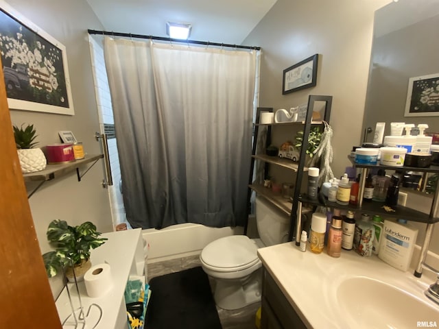 full bathroom featuring shower / tub combo with curtain, vanity, and toilet