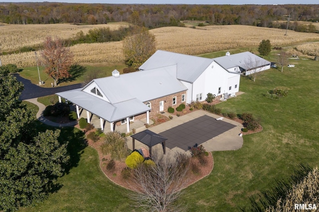 birds eye view of property with a rural view