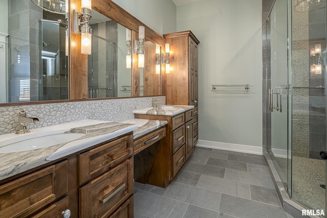 bathroom featuring an enclosed shower, backsplash, and vanity