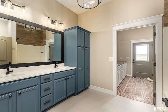 bathroom with vanity and a shower