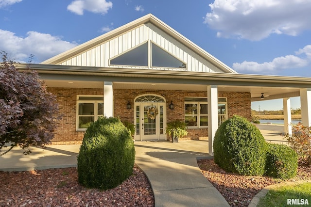 view of exterior entry featuring a porch