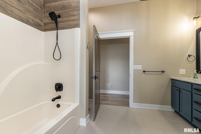 bathroom featuring vanity, tile patterned floors, and tub / shower combination