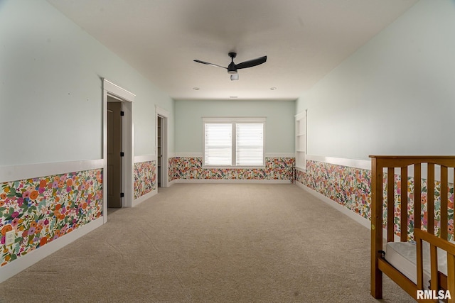 carpeted empty room with ceiling fan