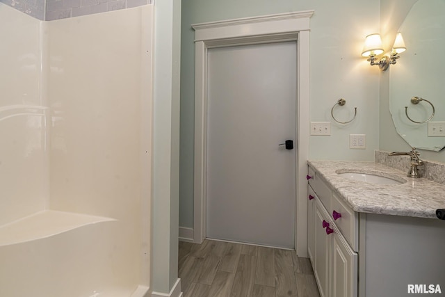 bathroom featuring vanity and hardwood / wood-style floors