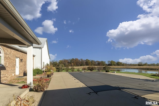 view of patio featuring a water view