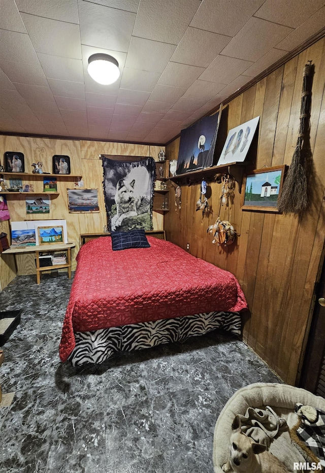 bedroom featuring wooden walls and carpet floors