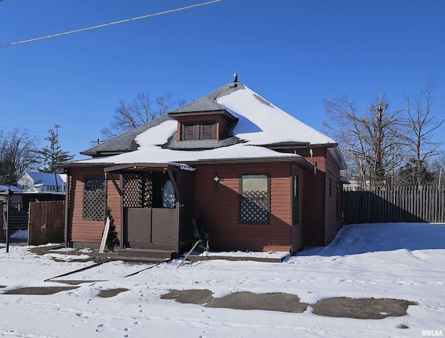 view of snow covered house