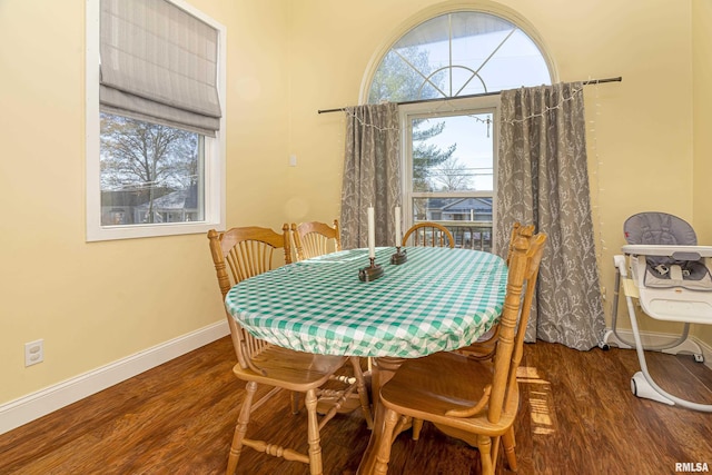 dining area featuring dark hardwood / wood-style flooring