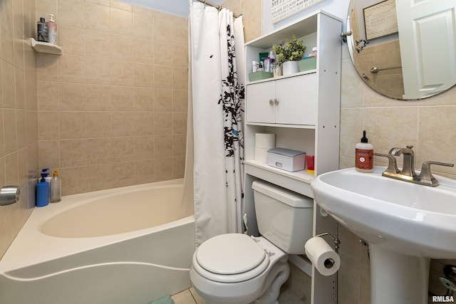 bathroom with tile walls, shower / tub combo, backsplash, and toilet