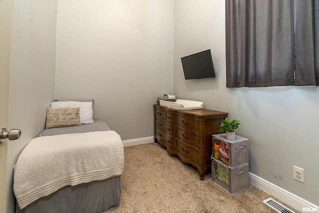 bedroom with light colored carpet