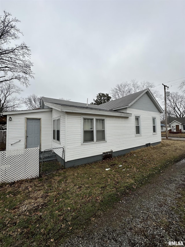 view of home's exterior featuring a yard