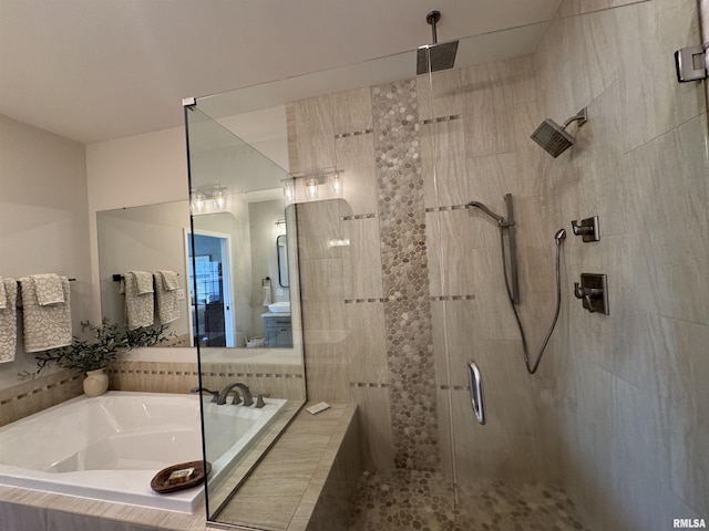 bathroom with shower with separate bathtub