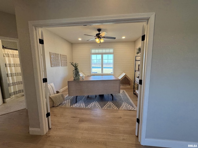 office area featuring light hardwood / wood-style flooring and ceiling fan