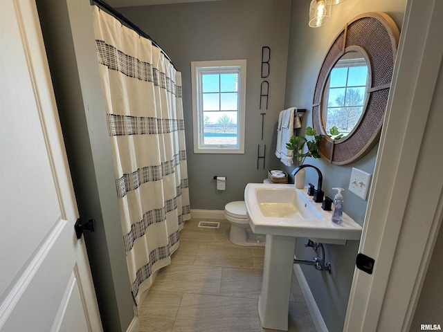 bathroom with toilet and sink