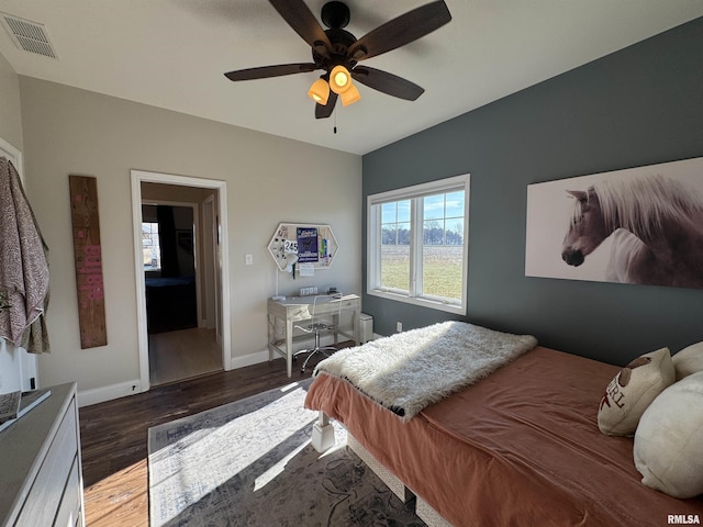 bedroom with ceiling fan and wood-type flooring